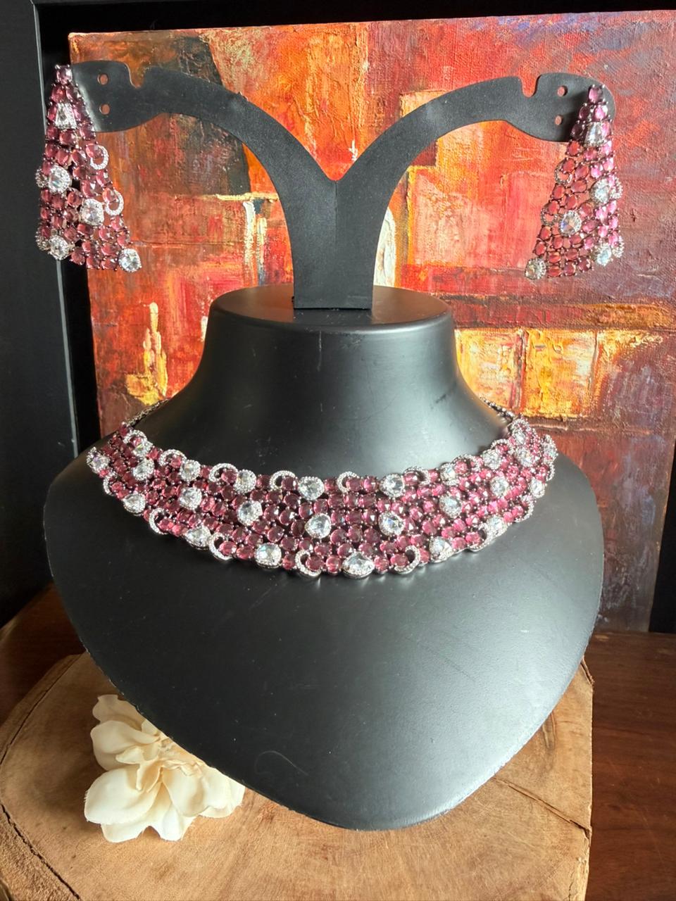 Ruby crystal bridal choker necklace set with layered stones and matching chandelier earrings.
