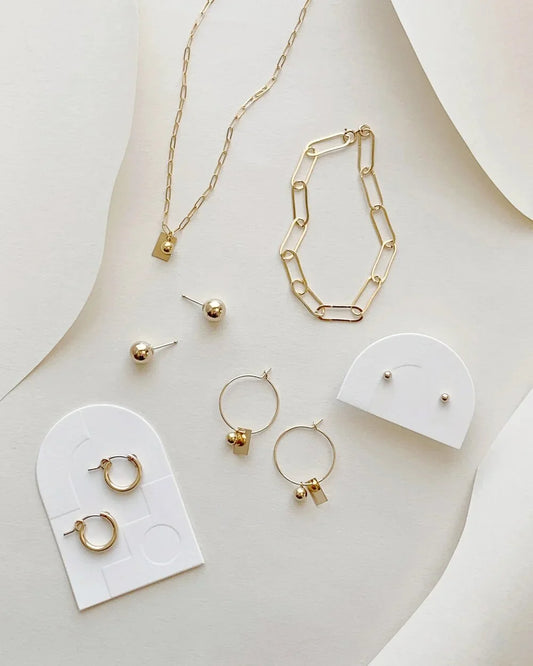 Minimalist luxury jewellery arranged as a curated collection, reflecting timeless design and everyday elegance.