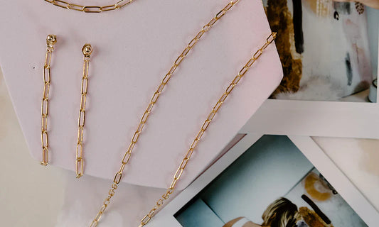 Flat lay of a necklace arranged neatly on neutral fabric to highlight length and design