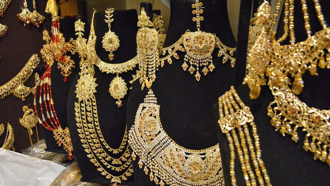 Traditional Pakistani regional jewellery including tribal silver and ornate gold pieces displayed