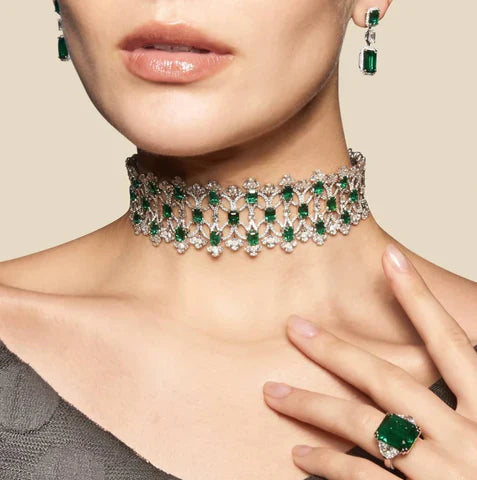 Elegant statement jewellery styled with a formal outfit in warm evening lighting