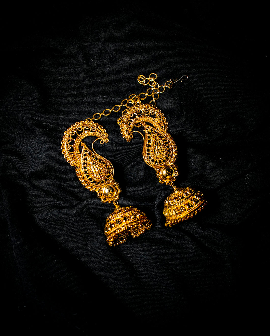 a gold and black necklace