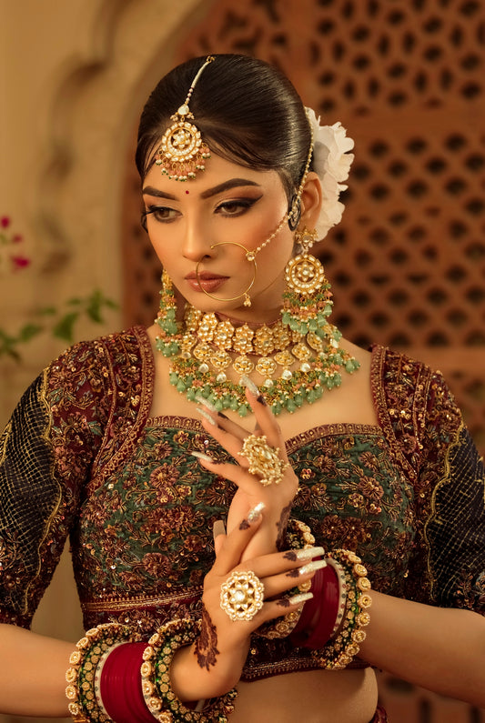 A woman in a bridal outfit with jewelry