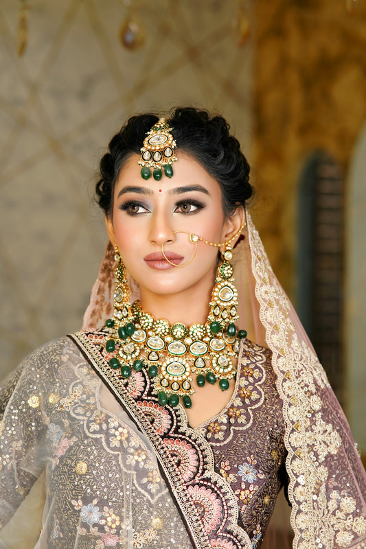 A woman wearing a bridal outfit and jewelry