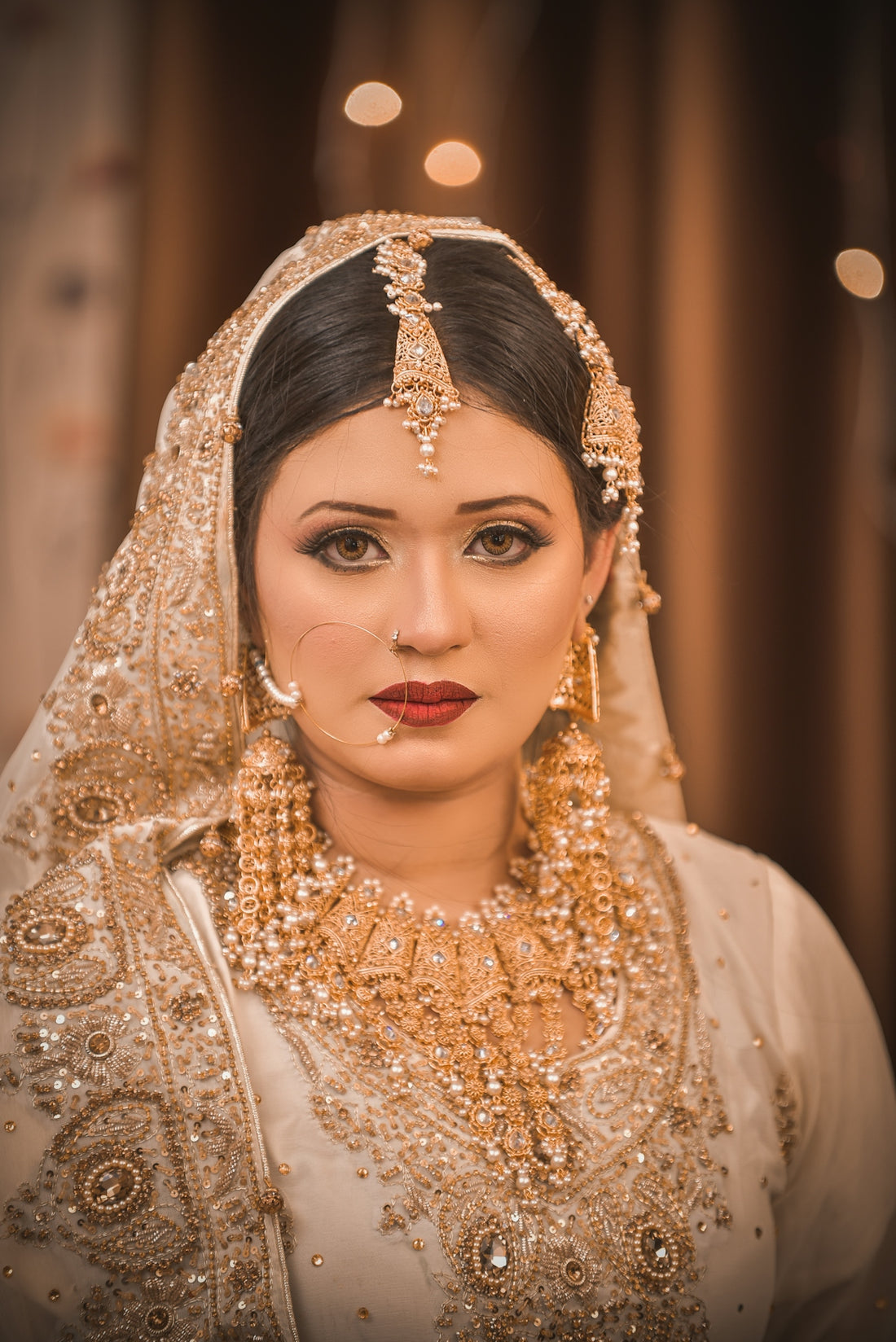 A beautiful bride looks regal in her wedding dress.