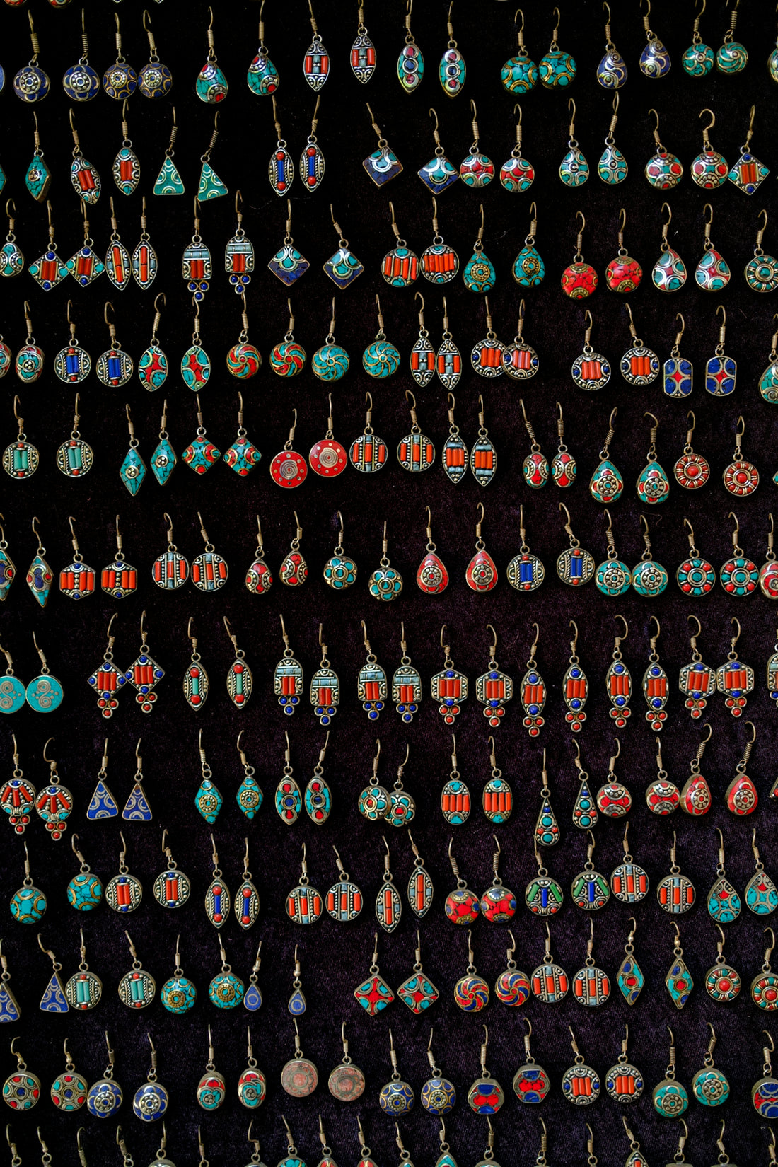 Assortment of colorful handmade earrings displayed