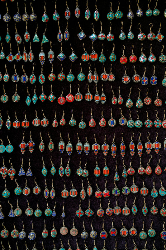 Assortment of colorful handmade earrings displayed