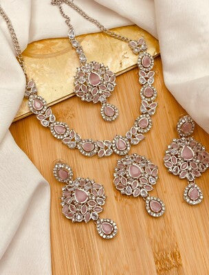 Luxury handcrafted Pakistani jewellery displayed in a modern studio setting, representing Dahlia by Sehar’s contemporary design aesthetic.