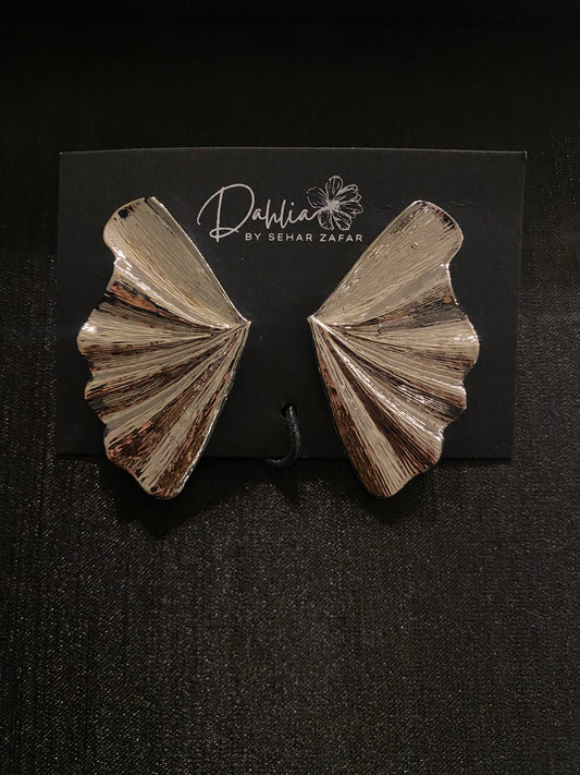Gold textured fan shaped statement earrings displayed on Dahlia by Sehar Zafar card