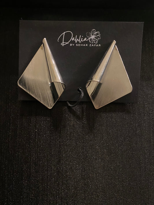 Brushed metal folded triangle earrings on black branded card
