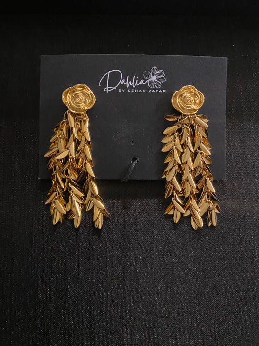 Gold rose chandelier earrings with cascading leaf drops on black branded card