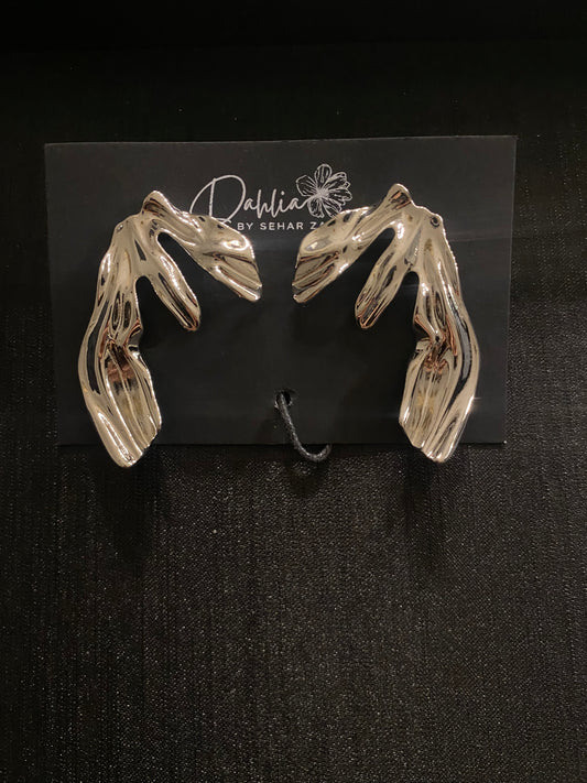 Gold cascading floral earrings with textured petals on black branded card