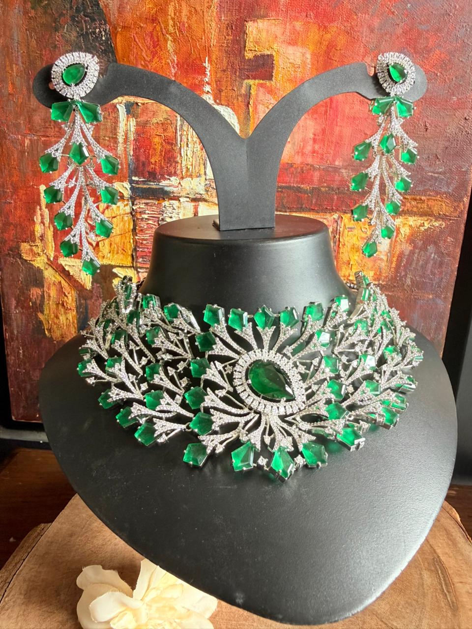 Emerald royal bridal statement necklace set with crystal vine detailing and matching long drop earrings.