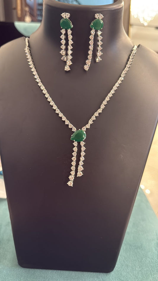 Jewelry set with necklace and earrings on a mannequin bust.